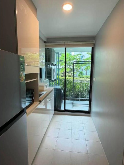 Renovated 1-bed condo for rent at The Centrio, garden pool view – photo 9