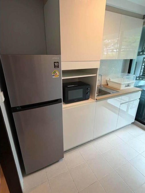 Renovated 1-bed condo for rent at The Centrio, garden pool view – photo 7